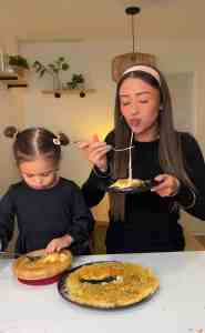 People enjoying the crispy texture and molten cheese center of an authentic Legendary Knafeh.