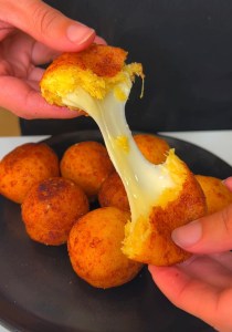 Cheesy platano maduro balls crispy fried and stuffed with mozzarella cheese